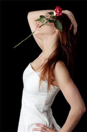 simsearch:400-03983962,k - Beautiful young woman in white dress with rose Fotografie stock - Microstock e Abbonamento, Codice: 400-04707945