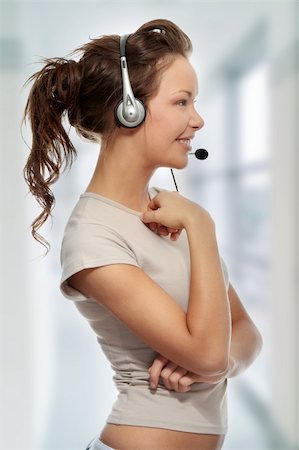 simsearch:400-03985399,k - Beautiful Call Center Woman Wearing A Telephone Headset Photographie de stock - Aubaine LD & Abonnement, Code: 400-04708105