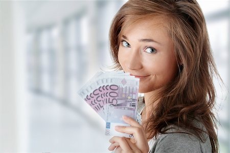 simsearch:400-04350998,k - Beautiful young woman holding euros bills - real estate loan concept Stock Photo - Budget Royalty-Free & Subscription, Code: 400-04708112