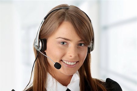 simsearch:400-03985399,k - Beautiful Call Center Woman Wearing A Telephone Headset, isolated on white background Photographie de stock - Aubaine LD & Abonnement, Code: 400-04708201