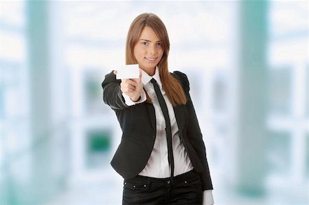 Beautiful young business woman with blank business card isolated on white background Foto de stock - Super Valor sin royalties y Suscripción, Código: 400-04708324