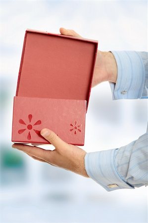 Business man opening a gift Stock Photo - Budget Royalty-Free & Subscription, Code: 400-04708427