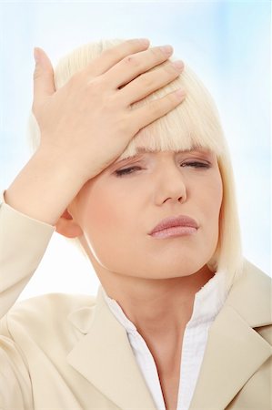 simsearch:400-04978521,k - Young business woman with headache,Over abstract blue background Stock Photo - Budget Royalty-Free & Subscription, Code: 400-04708436