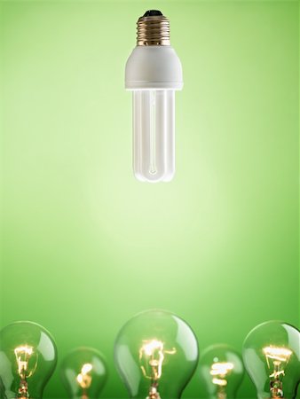 simsearch:400-04366277,k - fluorescent lightbulb over large group of tungsten lights on green background. Vertical shape, copy space Stock Photo - Budget Royalty-Free & Subscription, Code: 400-04708764