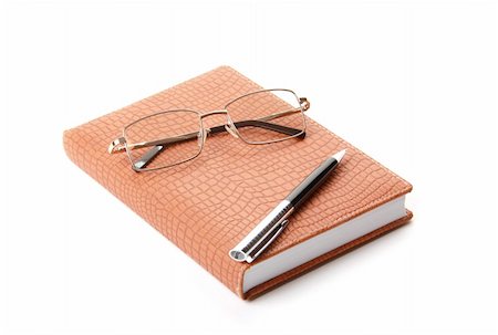simsearch:400-05381119,k - Datebook, pen and glasses. Isolated on white Stock Photo - Budget Royalty-Free & Subscription, Code: 400-04708974