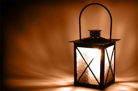 simsearch:400-06945463,k - Lit lantern on dark background, sepia toned Photographie de stock - Aubaine LD & Abonnement, Code: 400-04709096