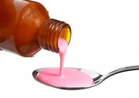 simsearch:625-02267134,k - close up of syrup, spoon and bottle on white background with clipping path Fotografie stock - Microstock e Abbonamento, Codice: 400-04709599
