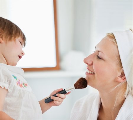 Charming mother taking care of her children at home Stock Photo - Budget Royalty-Free & Subscription, Code: 400-04709923