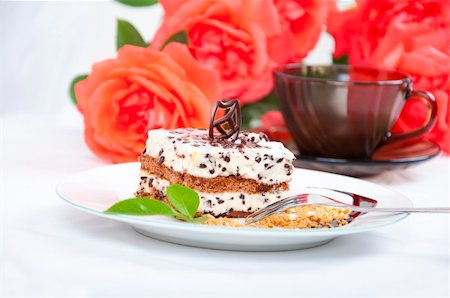 simsearch:400-05714765,k - Sweet chocolate dessert with nuts, rose and cup of coffee Stock Photo - Budget Royalty-Free & Subscription, Code: 400-04700020