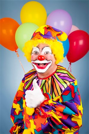 simsearch:400-04408991,k - Happy clown with balloons giving thumbs up sign. Foto de stock - Super Valor sin royalties y Suscripción, Código: 400-04700197