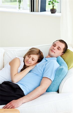 simsearch:400-06415374,k - Affectionate couple sleeping lying on a sofa at home Stock Photo - Budget Royalty-Free & Subscription, Code: 400-04700316