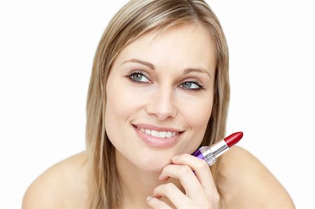 Attractive woman holding red lipstick against a white background Stock Photo - Budget Royalty-Free & Subscription, Code: 400-04700519