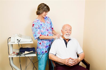 elderly physiotherapy - Chiropractic nurse gives ultrasound therapy to a senior patient for relief of neck pain. Stock Photo - Budget Royalty-Free & Subscription, Code: 400-04700630