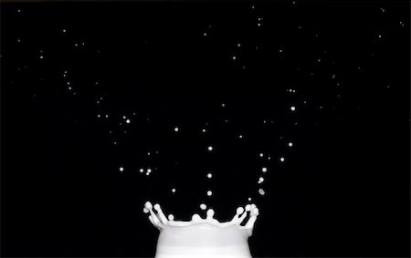 Crown-shaped splash of milk on black background Stock Photo - Budget Royalty-Free & Subscription, Code: 400-04700696