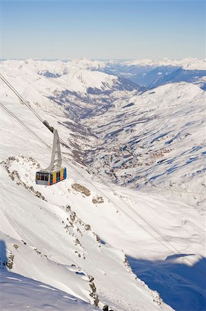 Large cable car ascending a snowy mountain valley Stock Photo - Budget Royalty-Free & Subscription, Code: 400-04700732