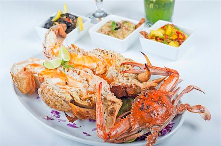 A la carte seafood meal of fresh crab and lobster on a white plate Stock Photo - Budget Royalty-Free & Subscription, Code: 400-04700746