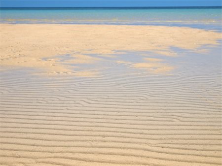 simsearch:400-05154191,k - Tropical beach with a clean yellow sand Stock Photo - Budget Royalty-Free & Subscription, Code: 400-04701367