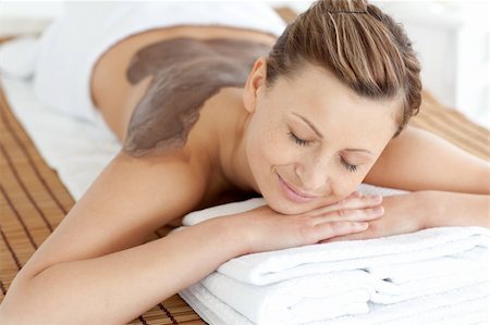simsearch:400-04192063,k - Relaxed woman enjoying a mud skin treatment in a Spa center Fotografie stock - Microstock e Abbonamento, Codice: 400-04701479