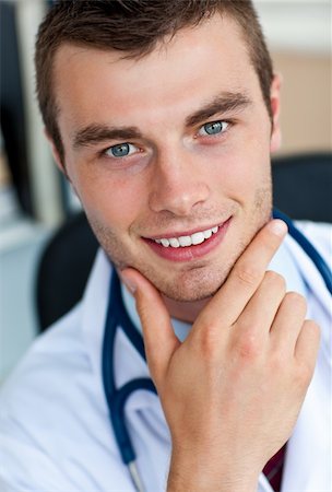 Portrait of a cheerful male doctor smiling at the camera Stock Photo - Budget Royalty-Free & Subscription, Code: 400-04702330