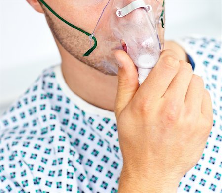 Close-up of a patient with a mask having flu Stock Photo - Budget Royalty-Free & Subscription, Code: 400-04702340