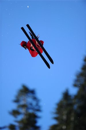 simsearch:400-04256964,k - A skier in a red suit gets air during a trick. Stock Photo - Budget Royalty-Free & Subscription, Code: 400-04702583