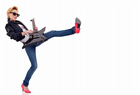 rebellious girl - picture of a young woman kicking and playing an electric guitar Stock Photo - Budget Royalty-Free & Subscription, Code: 400-04702841