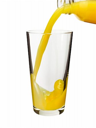 pouring orange juice in a glass from a bottle of glass Stock Photo - Budget Royalty-Free & Subscription, Code: 400-04702961