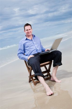 business man sitting on a chair on the beach with laptop Stock Photo - Budget Royalty-Free & Subscription, Code: 400-04703653