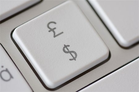 pound and dollar sign - British pound and american dollar on a computer keyboard, concept exchange rate or online shopping Stock Photo - Budget Royalty-Free & Subscription, Code: 400-04714001