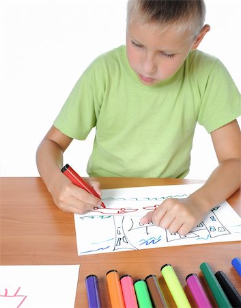 simsearch:400-04123378,k - Schoolboy doing bored his homework on white background Photographie de stock - Aubaine LD & Abonnement, Code: 400-04714284