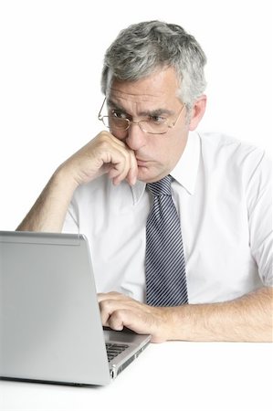 simsearch:400-04204942,k - senior businessmen focused on laptop work computer white background Stock Photo - Budget Royalty-Free & Subscription, Code: 400-04715189
