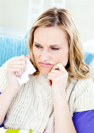 simsearch:400-04212905,k - Downcast woman lying on a sofa with tissues against a white background Stock Photo - Budget Royalty-Free & Subscription, Code: 400-04715316