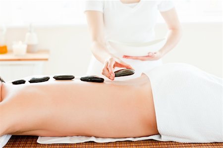 simsearch:400-04192103,k - Close-up of a young man receiving hot stone on his back in a spa center Stock Photo - Budget Royalty-Free & Subscription, Code: 400-04715362