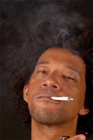African american male after lighting a spliff Stock Photo - Budget Royalty-Free & Subscription, Code: 400-04715426