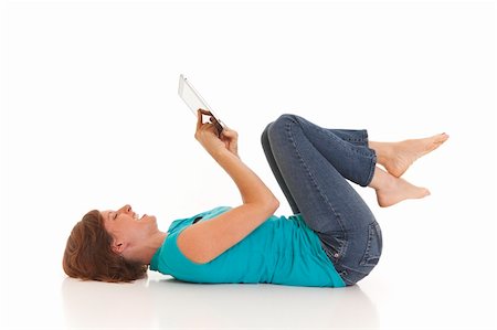 Young woman casually laying on floor with I pad Stock Photo - Budget Royalty-Free & Subscription, Code: 400-04715578
