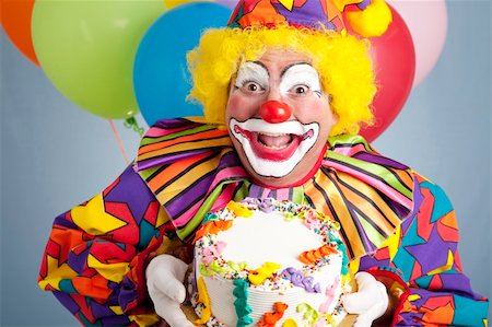Happy birthday clown holding a blank cake ready for your text. Stock Photo - Budget Royalty-Free & Subscription, Code: 400-04715582