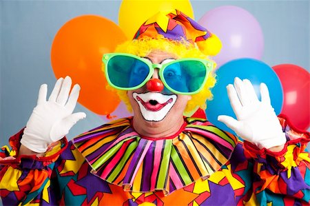 simsearch:400-04408991,k - Silly clown in oversized glasses, making a surprised face. Foto de stock - Super Valor sin royalties y Suscripción, Código: 400-04715596