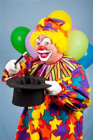 simsearch:400-04408991,k - Funny birthday clown does magic tricks with a top hat and wand. Foto de stock - Super Valor sin royalties y Suscripción, Código: 400-04715592