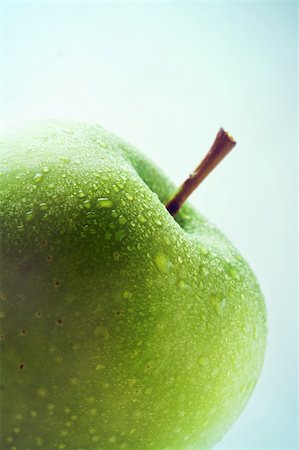 Fresh big green apple isolated on blue gradient background Stock Photo - Budget Royalty-Free & Subscription, Code: 400-04715696