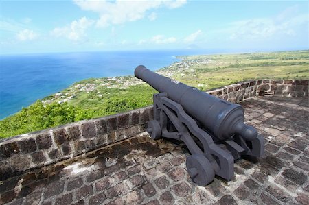 french west indies - A cannon faces the Caribbean Sea at Brimstone Hill Fortress National Park on the island of St Kitts. Stock Photo - Budget Royalty-Free & Subscription, Code: 400-04715782