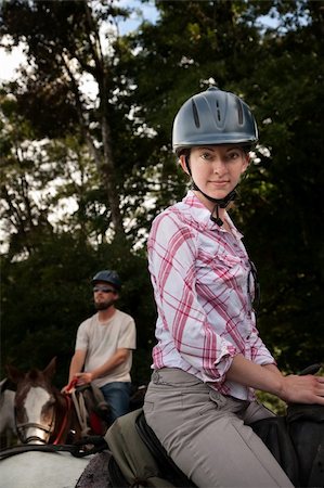 Equestrian couple posing on a horse ranch in Costa Rica Stock Photo - Budget Royalty-Free & Subscription, Code: 400-04715957