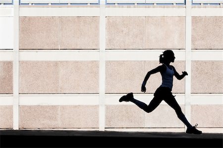runner silhouette - Woman in the shadows of building runs for exercise. Photographie de stock - Aubaine LD & Abonnement, Code: 400-04715960