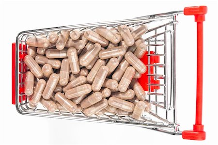 Carts on a white background filled with pills Stock Photo - Budget Royalty-Free & Subscription, Code: 400-04716178