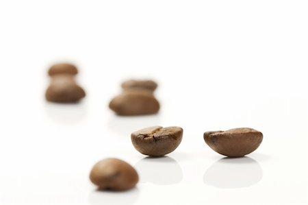 simsearch:400-05260472,k - focus on two coffee beans between others on white background Stock Photo - Budget Royalty-Free & Subscription, Code: 400-04716283