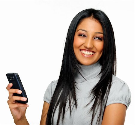 Indian woman laughs and holds phone Foto de stock - Super Valor sin royalties y Suscripción, Código: 400-04717172
