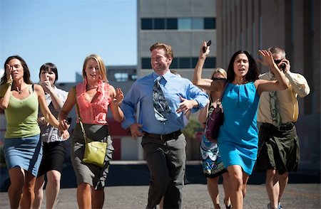 simsearch:400-04717565,k - Group of hard working business men and women run down city street. Stock Photo - Budget Royalty-Free & Subscription, Code: 400-04717566