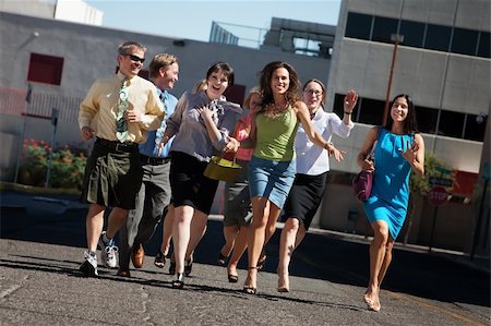 running in heels - Happy group of business people running on city street Stock Photo - Budget Royalty-Free & Subscription, Code: 400-04717569
