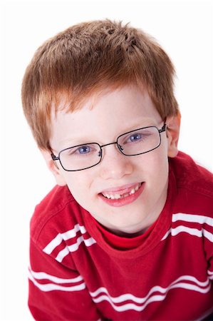 simsearch:400-05745952,k - Portrait of a cute young boy with glasses isolated on white background. Studio shot. Stock Photo - Budget Royalty-Free & Subscription, Code: 400-04717679