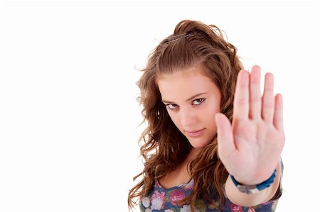 young girl  with his hand raised in signal to stop, isolated on white background, Studio shot Stock Photo - Budget Royalty-Free & Subscription, Code: 400-04717768