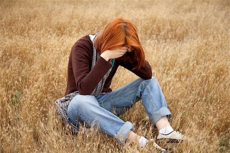 Lonely sad red-haired girl at field Stock Photo - Budget Royalty-Free & Subscription, Code: 400-04717825